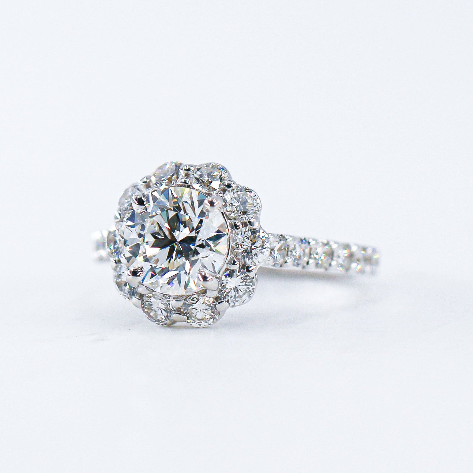 round brilliant cut diamond halo engagement rings  melbourne australia unique design