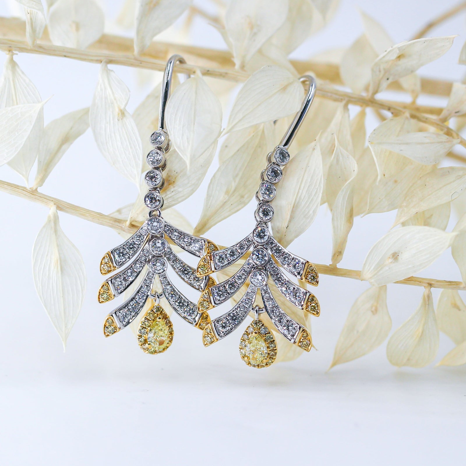 Pear shaped Fancy intense yellow diamond earrings sydney in stock