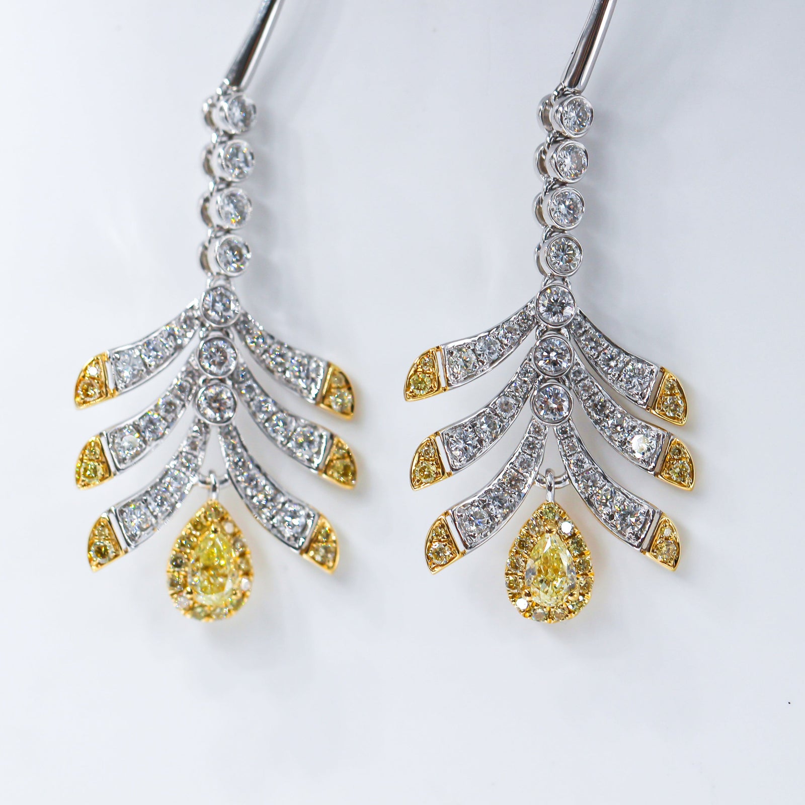 Pear shaped Fancy intense yellow diamond earrings sydney in stock