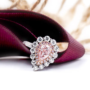 Pear shaped Fancy intense pink  diamond halo rings  sydney smart investment